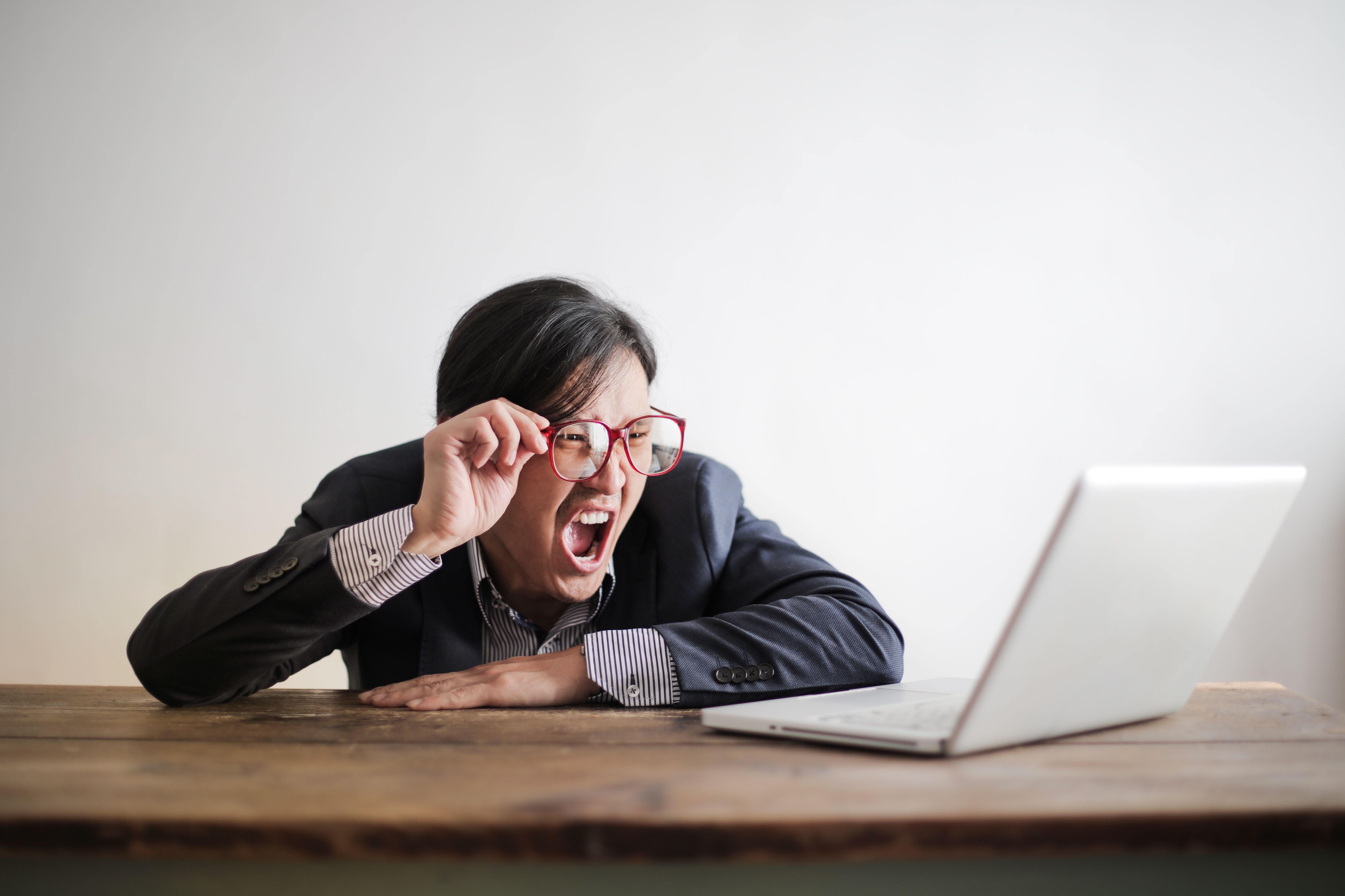 confused man with laptop